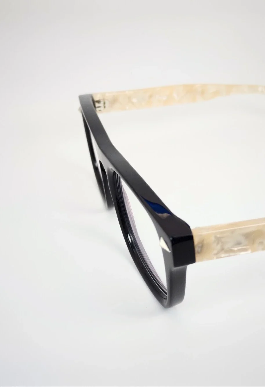 Fluoresce. Black Wayfarer-Style Eyeglasses with Pearl Temples.